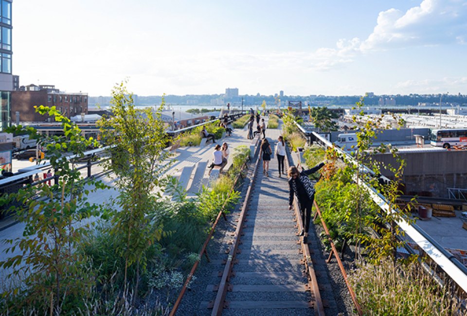 Kids can walk along exposed tracks during a visit to the High Line