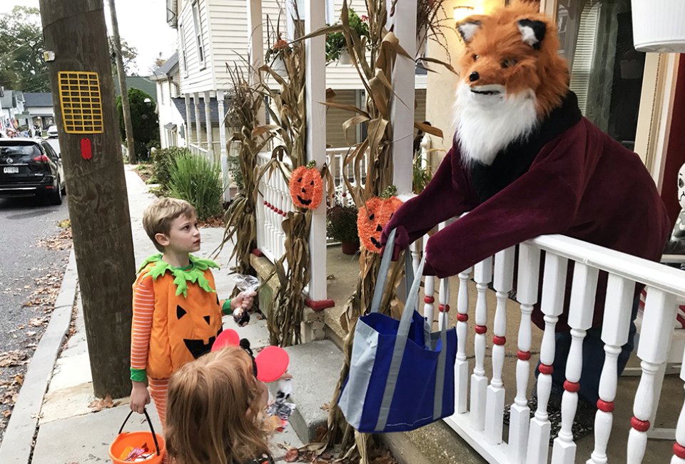 A fox hands out candy to trick-or-treaters in Pitman. Photo by Lisa Warden