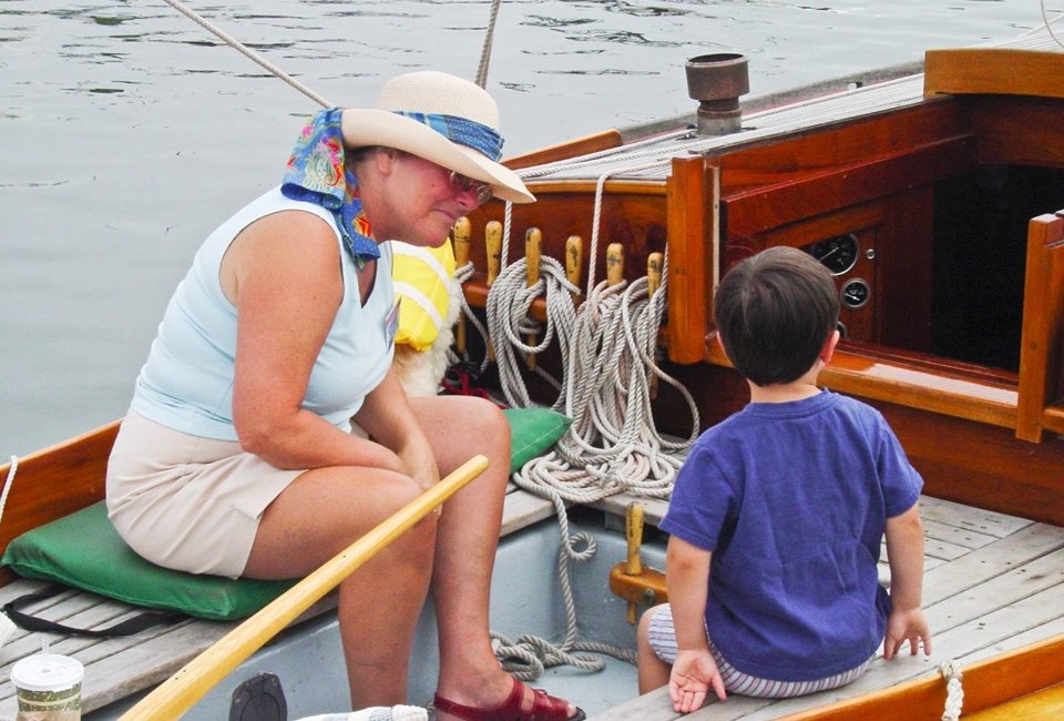 Kids get up close to some special classic boats in Salem. Photo courtesy of the  Antique & Classic Boat Festival