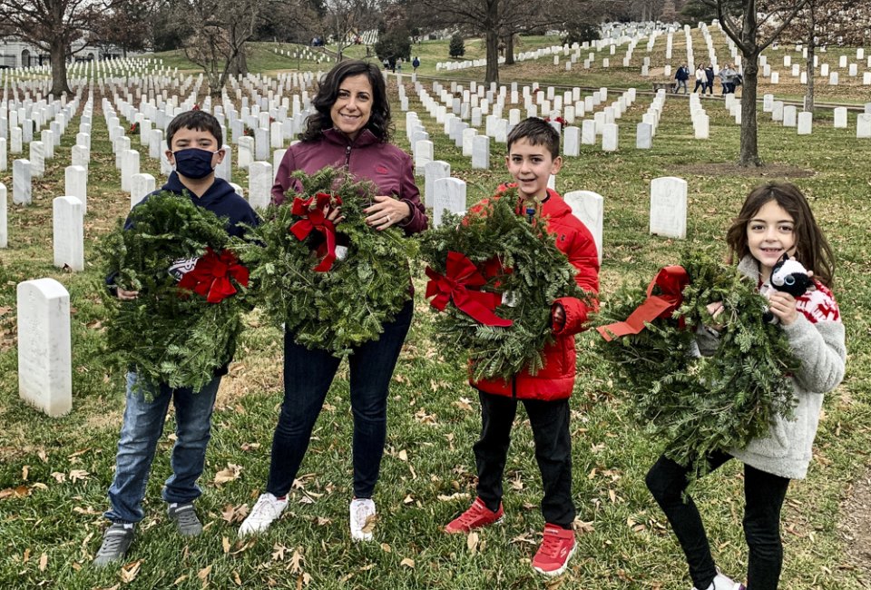 Place wreaths at the graves of fallen soldiers during the annual Wreaths Across America event. Photo courtesy of the author