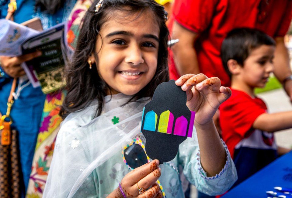 Celebrate the Festival of Eid. Photo of girl celebrating by Chris Dunn, courtesy of Asia Society Texas