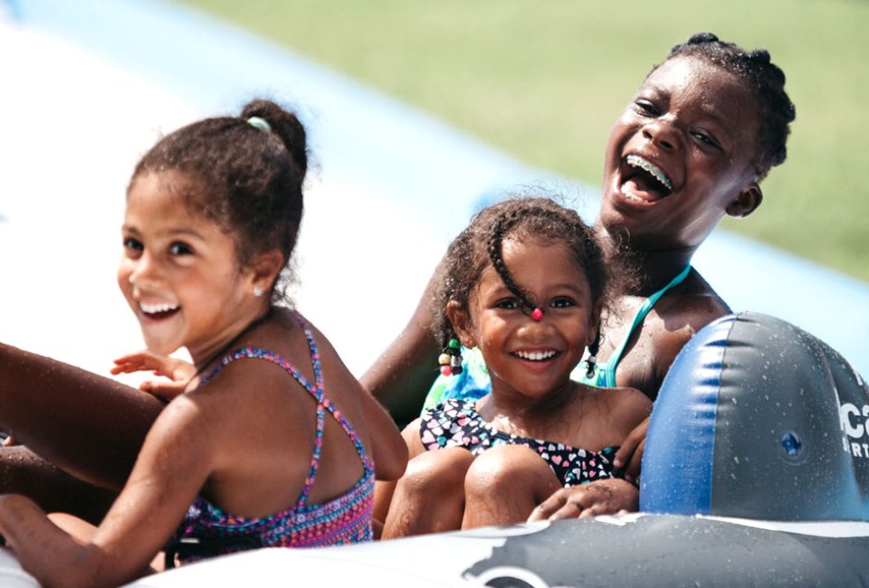 Bring the whole family to Roswell’s Slip-N-Slide Extravaganza, and go slip-sliding away into the summer. Photo courtesy of Roswell