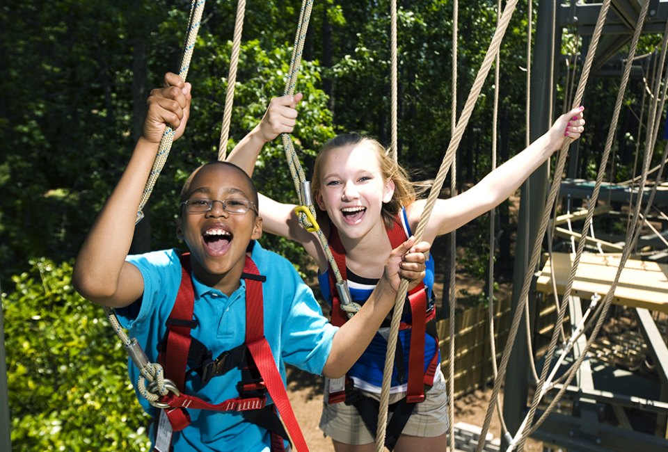 During certain times of the year, families can venture to Stone Mountain Park's SkyHike--an all-ages ropes adventure course.