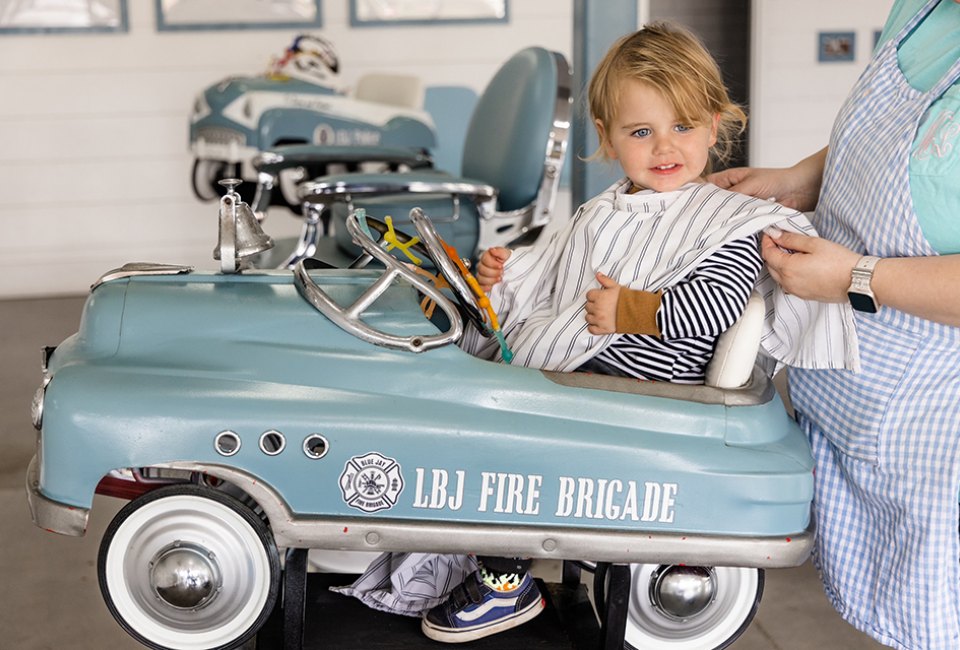 The Little Bluejay has some super cool rides for your kid to enjoy while getting a haircut. Photo by Emily Baas
