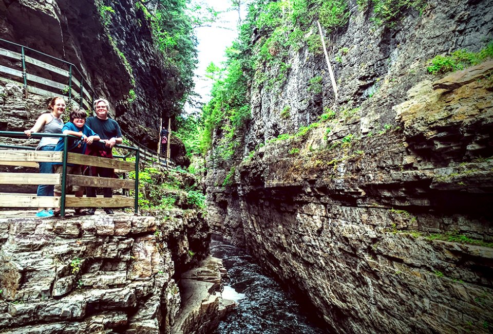 Ultimate New York Bucket List: 100 Things To Do with Kids in NY State The Ausable Chasm has been described as the Grand Canyon of the Adirondacks and it's one of our top 100 things to do in New York State with kids. Photo by Anna Fader