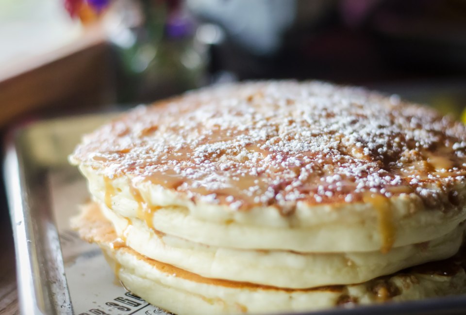 Tempt yourself with the banana crumb pancakes at The Flour Shoppe Cafe.