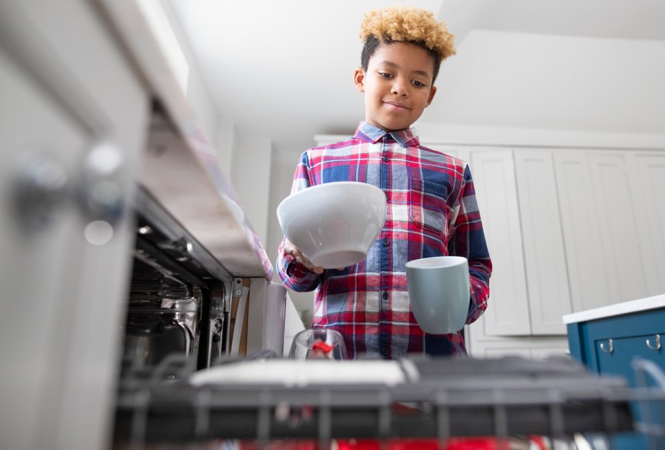 Kids as young as age 10 can help load and unload the dishwasher.