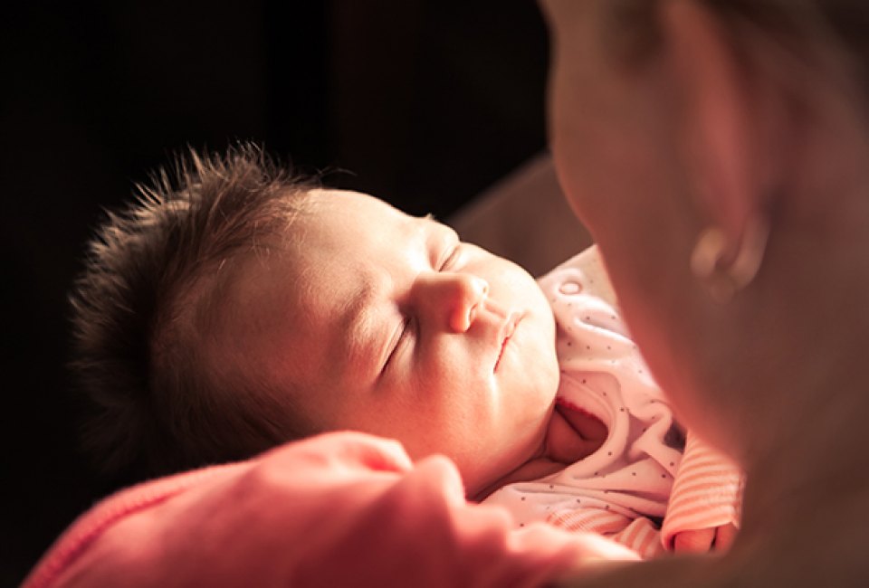 A baby night nurse can help get baby on a sleep schedule so parents can bond with the newest addition to their family. Photo by Mommy Poppins 