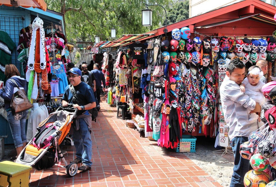 People bustle along Olvera Street