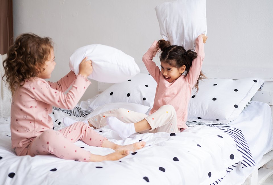 Did you know a pillow fight is a great way to get proprioceptive input? Photo by Mommy Poppins