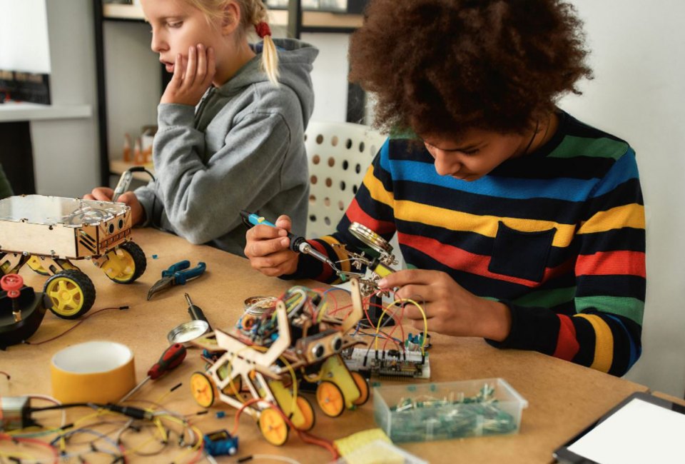 Photo of a smile doing STEM winter activities at a table.