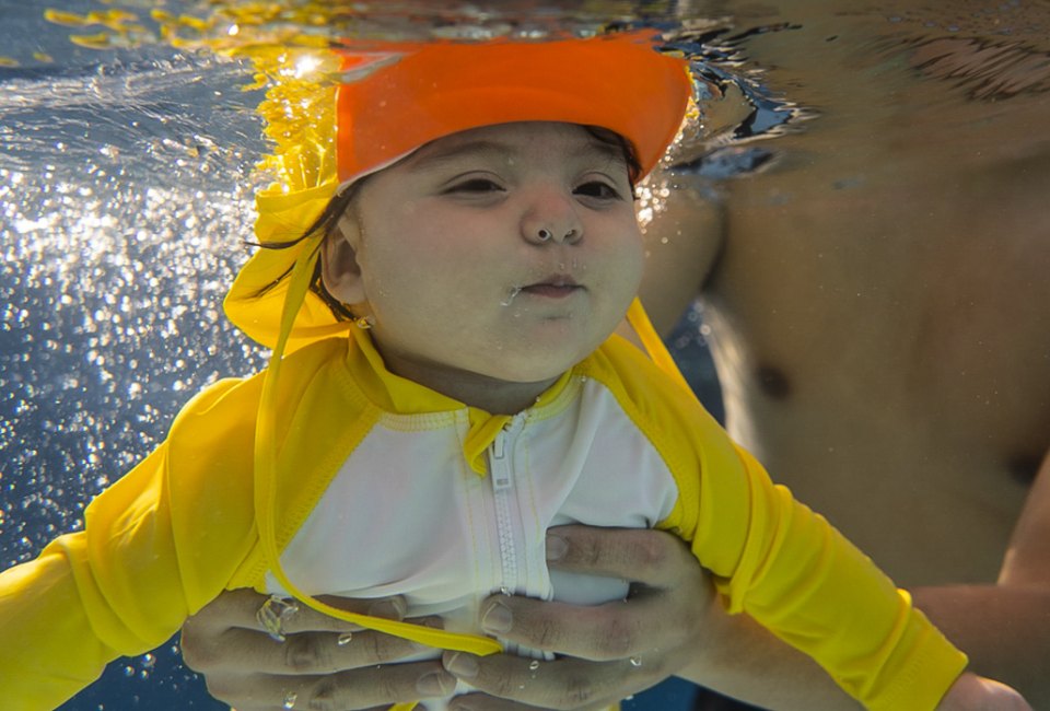 Baby swim classes get LA kids water safe, from a very young age. Photo courtesy of the Blue Buoy Family Swim School 