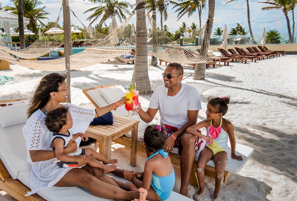 Relax by the beach at the family-friendly Blue Haven Resort in Turks and Caicos.