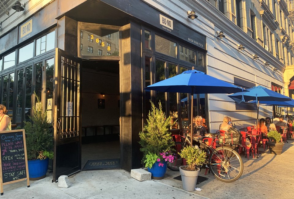 Bono Trattoria's bright exterior and fresh flavors welcome guest for outdoor dining. 