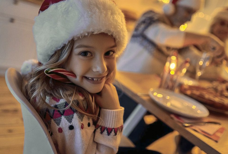 Image of girl in holiday attire - Restaurants open on Christmas