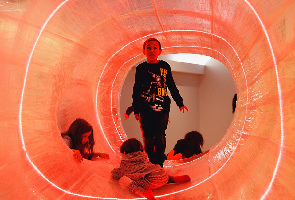 Part exhibit, part playground, TapeScape features climbing tunnels with spirals of LED lights.
