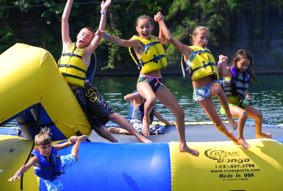 Bounce, splash, and make the most of summer at the best inflatable water parks in New England. Photo courtesy of Brownstone Adventure Sports Park