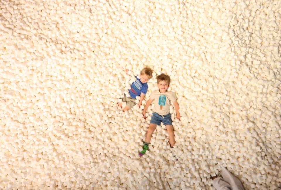 Diving into a pit of marshmallows at Candytopia. Photo by Carrie Taylor/Mommy Poppins