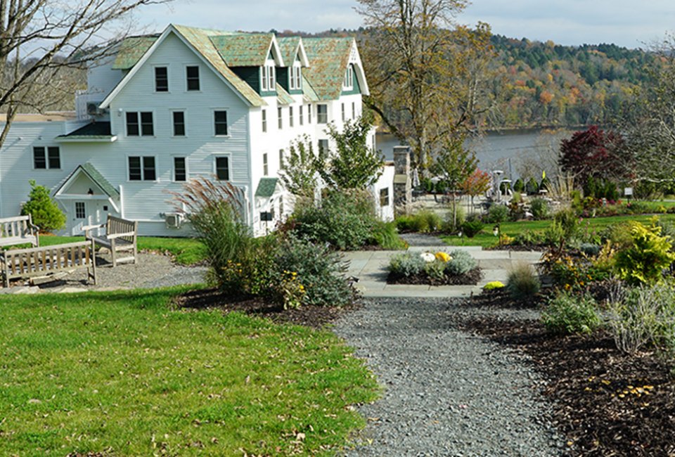 The historic Kenoza Hall is perched on a hillside, boasts lake-front views, and soon family-friendly bungalows. Photo by the author