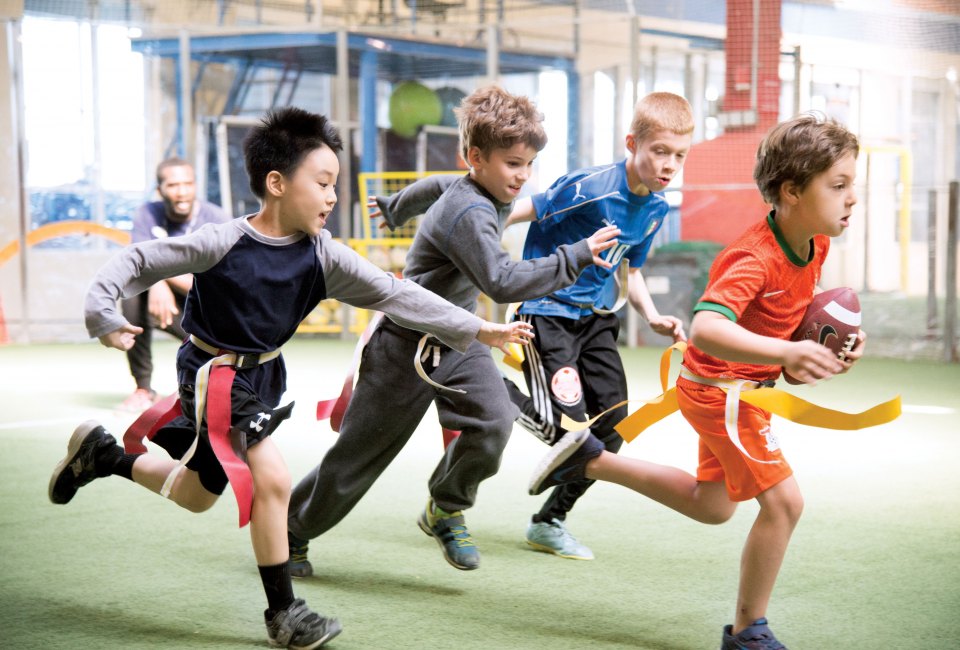 In addition to the wide variety of sports classes including baseball, basketball, soccer, and Parkour, the Field House at Chelsea Piers offers a flag football program for children ages 7 – 10 that consists of skill development and game play. Photo by Scott McDermott