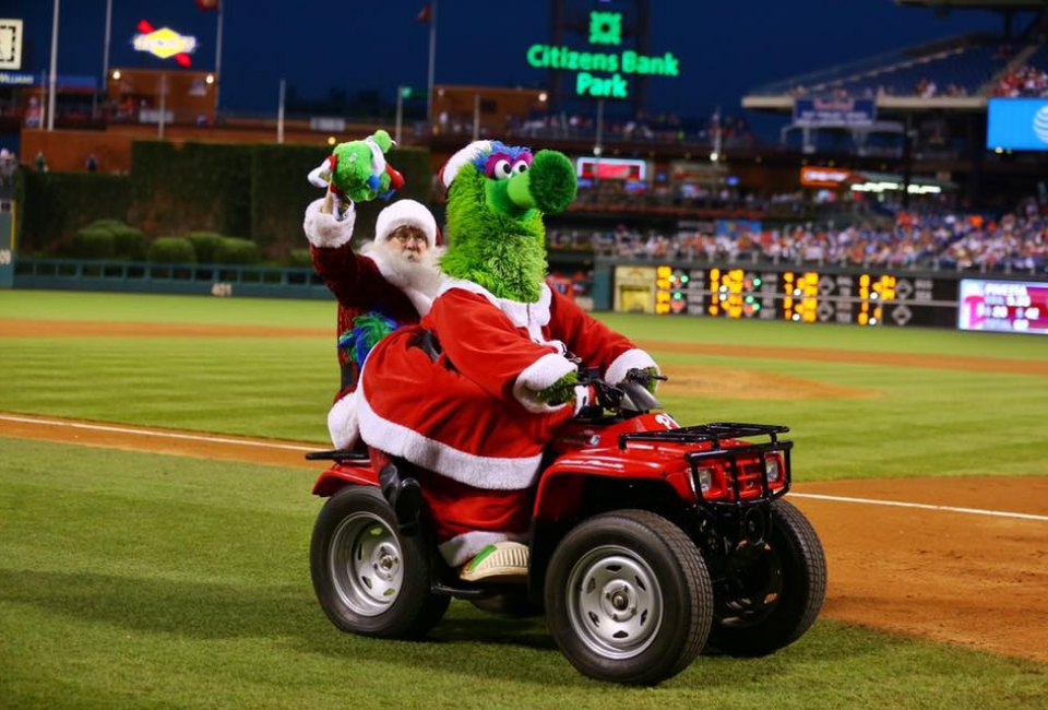 Santa and the Phanatic ride off into the sunset after a successful Christmas in July game. Photo courtesy of Miles Kennedy