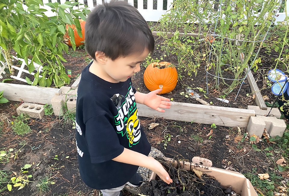 Just one kid composting can save 400 pounds of food waste a year. So yes, one kid can make a difference! Photo by Maureen Wilkey