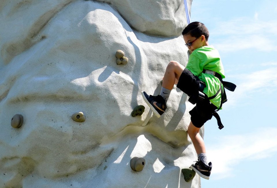 Climb high at Clayton Park, where Monmouth County Parks pulls out its portable 25-foot climbing wall for visitors to scale.  