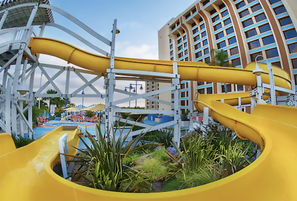 Twsit, turn, then plunge into refreshing waters with a wild ride down the water slide at Disney Paradise Piers Hotel. 