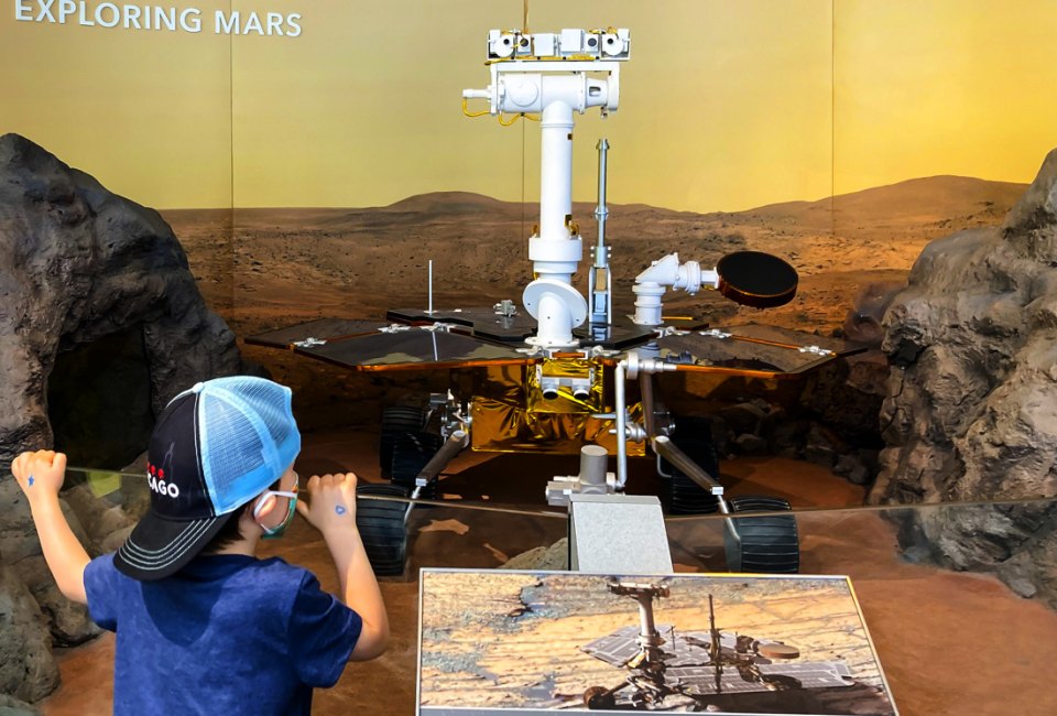 Checking out the exhibits at Adler Planetarium in Chicago. Photo by Maureen Wilkey