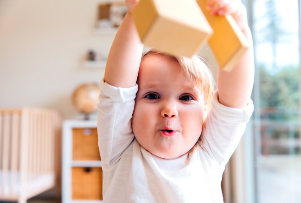 Walking, talking, grabbing, holding, smiling, laughing... it's all coming. But when? Photo by Tatiana Syrikova, via Pexels