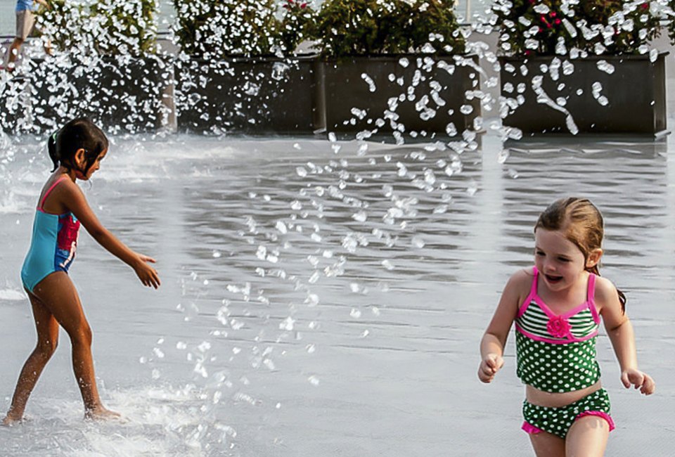 Enjoy the scenery on the Georgetown Waterfront while splashing in the fountain. Photo by Sam Kittner, courtesy of  georgetowndc.com