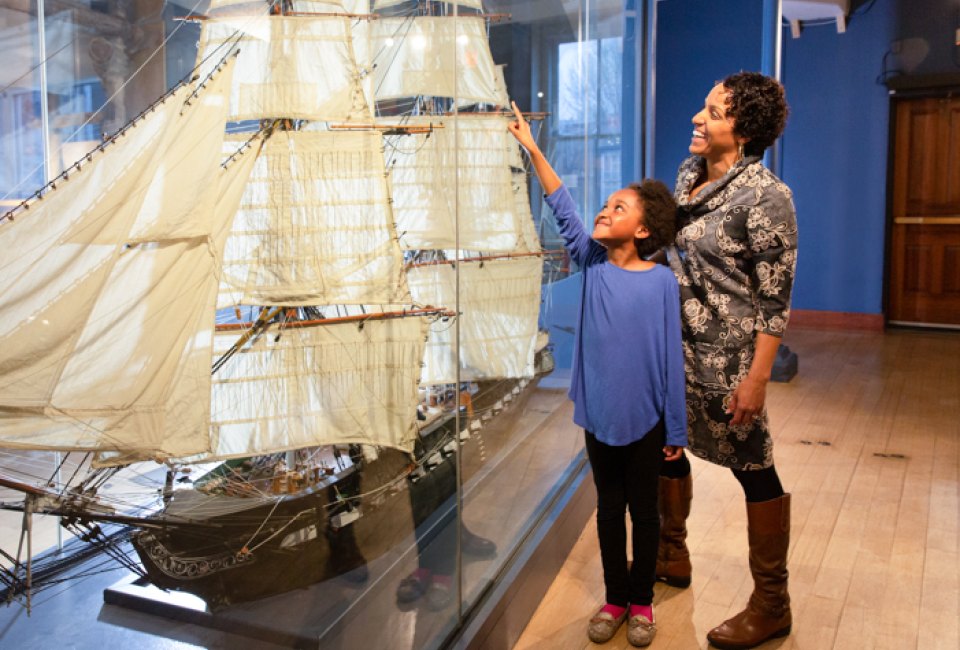 Image of mother and child with model ship - Christmas Vacation in Boston