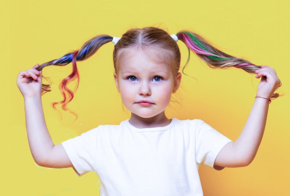 Punch up pigtails with some colorful hair chalk for kids. Photo courtesy of Magicat Premium Hair Chalk
