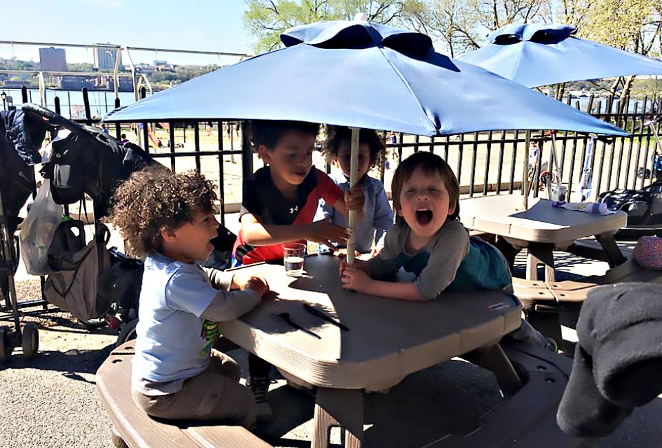 Kids get their own special outdoor dining tables at Ellington in the Park. Photo by Shira Kronzon.
