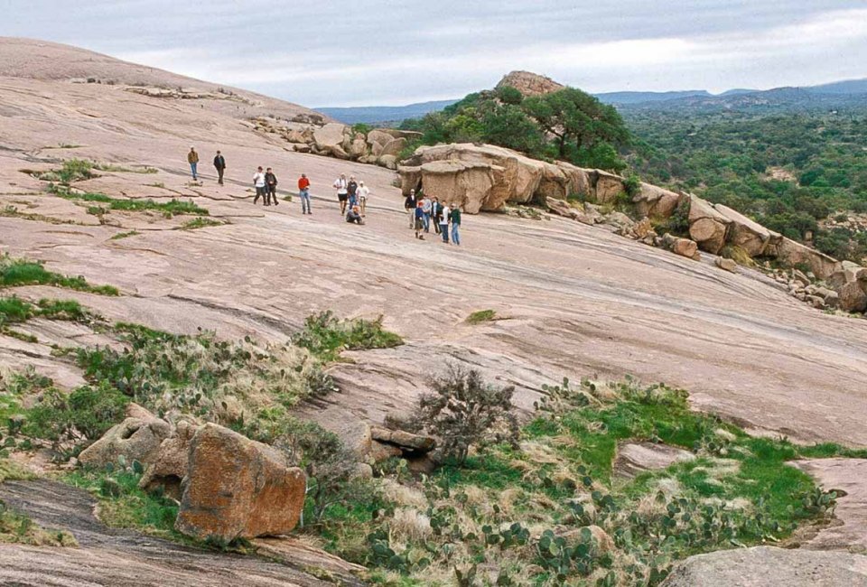 Make it an unforgettable family getaway from Houston  by hiking Enchanted Rock. Photo courtesy Passport to Texas.