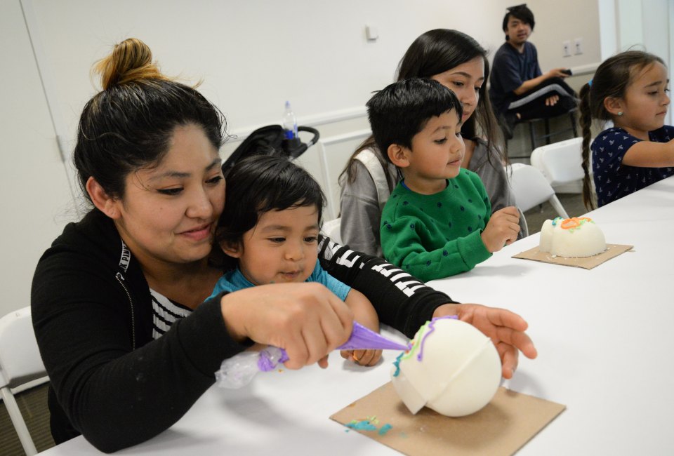 Fiesta Matsuri participants enjoying a skull candy decorating workshop. Photo by Scott Oshima
