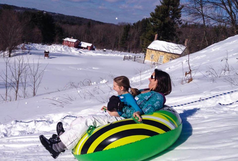 Photo of parent and child snow tubing-Winter Activities near Boston