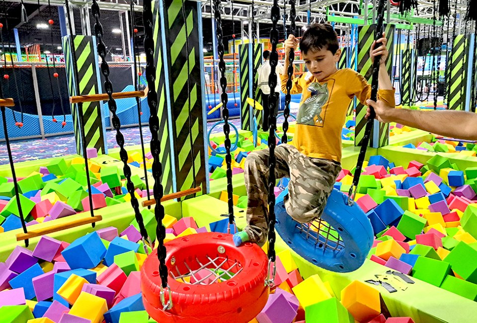 Fun Max Adventure Park's features include slides, a ball pit, and an obstacle course.