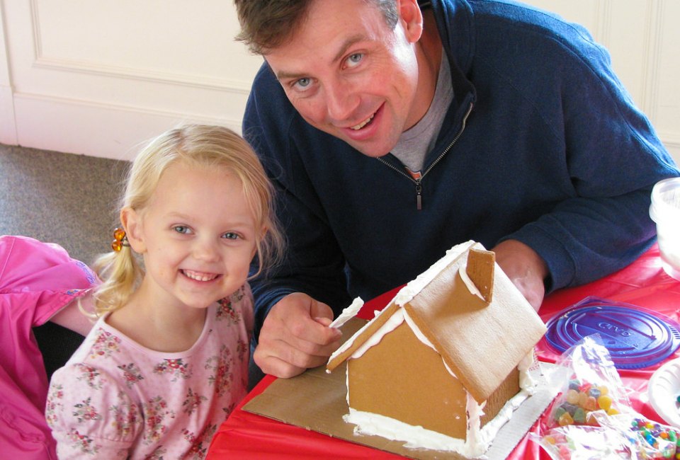 Decorating a gingerbread house is a sweet holiday tradition for the whole family.