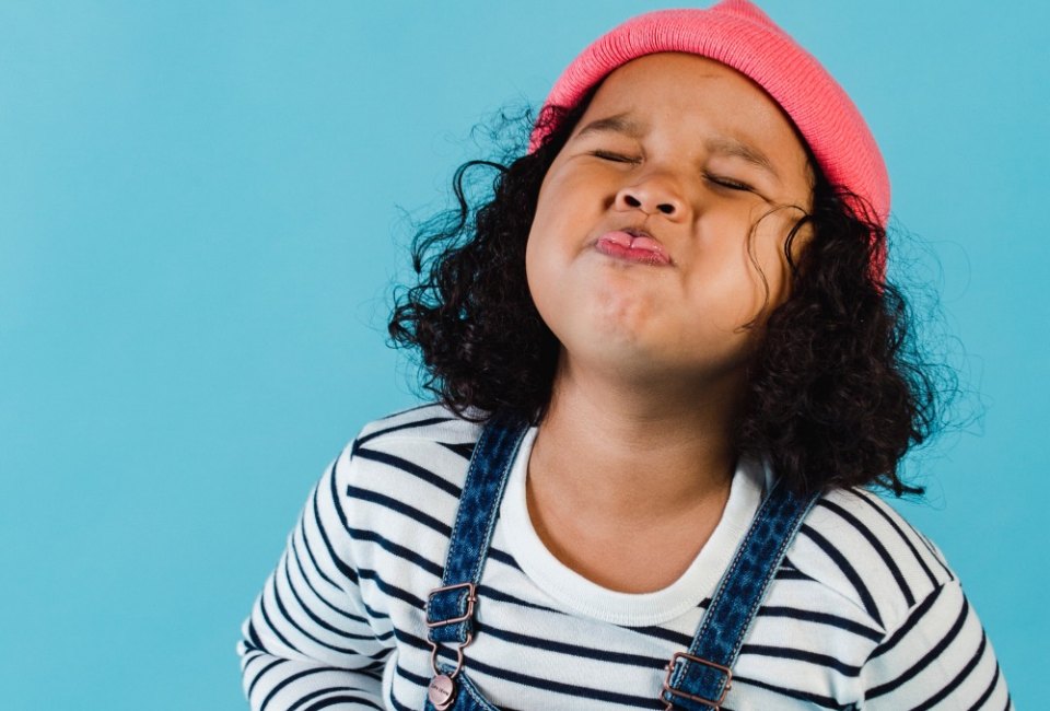 Photo of girl laughing by Amina Filkins via Pexels