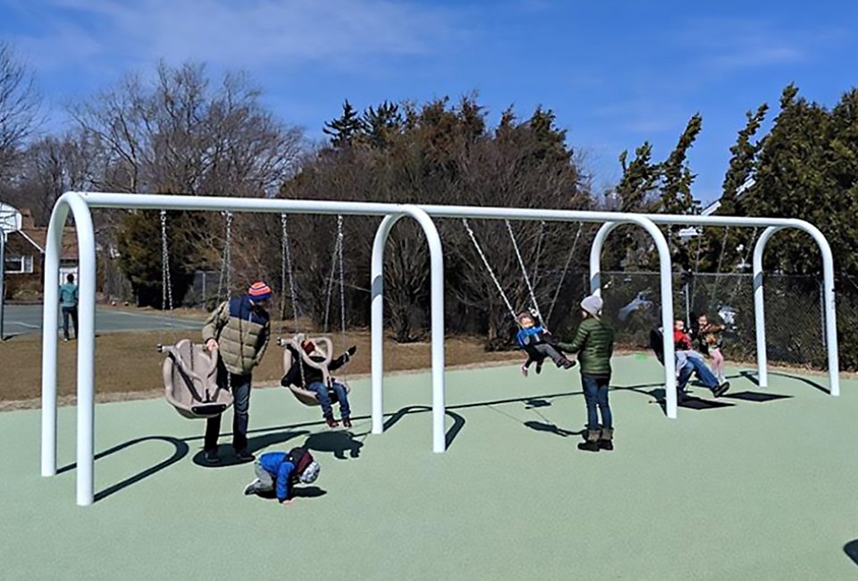Kids of all abilities will delight in the Pickle Park swing area.