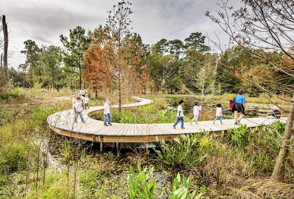 Kids walk a nature trail at the Houston Arboretum & Nature Center. Photo courtesy of the Houston Arboretum