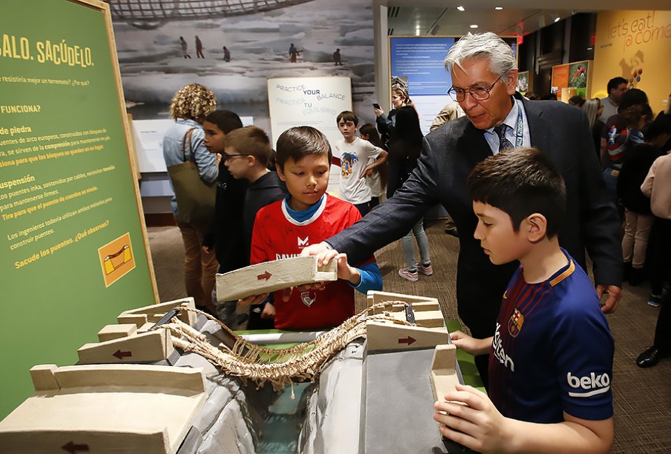  Kevin Gover, the director of The National Museum of the American Indian, and visitors play with 