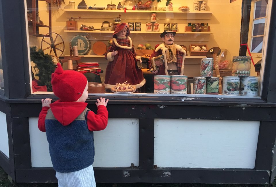 The viewing windows at Dickens Village in Maplewood are just the right height for little visitors. Photo by Rose Gordon Sala