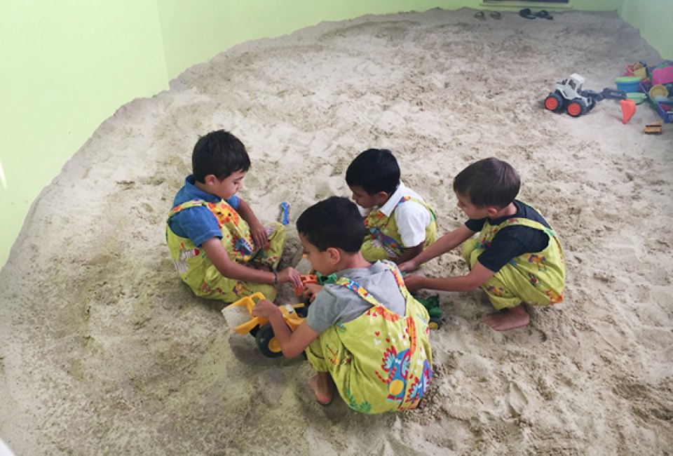 Play in the sand during a birthday part at The Great Story