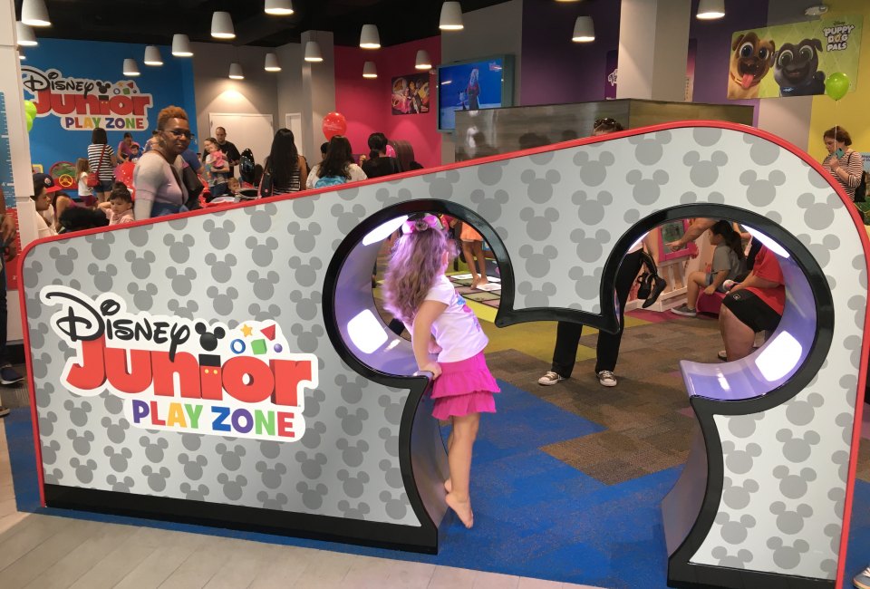 Kids can walk through a pair of Mickey ears to enter the play space. 