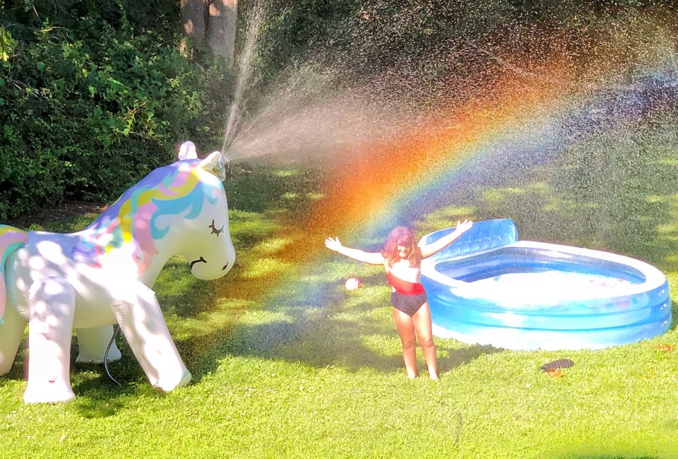 Set up a kiddie pool and mega sprinkle for backyard summer fun. Photo by Ally Noel