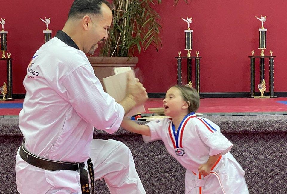 Break the board during a karate class at International Martial Arts.