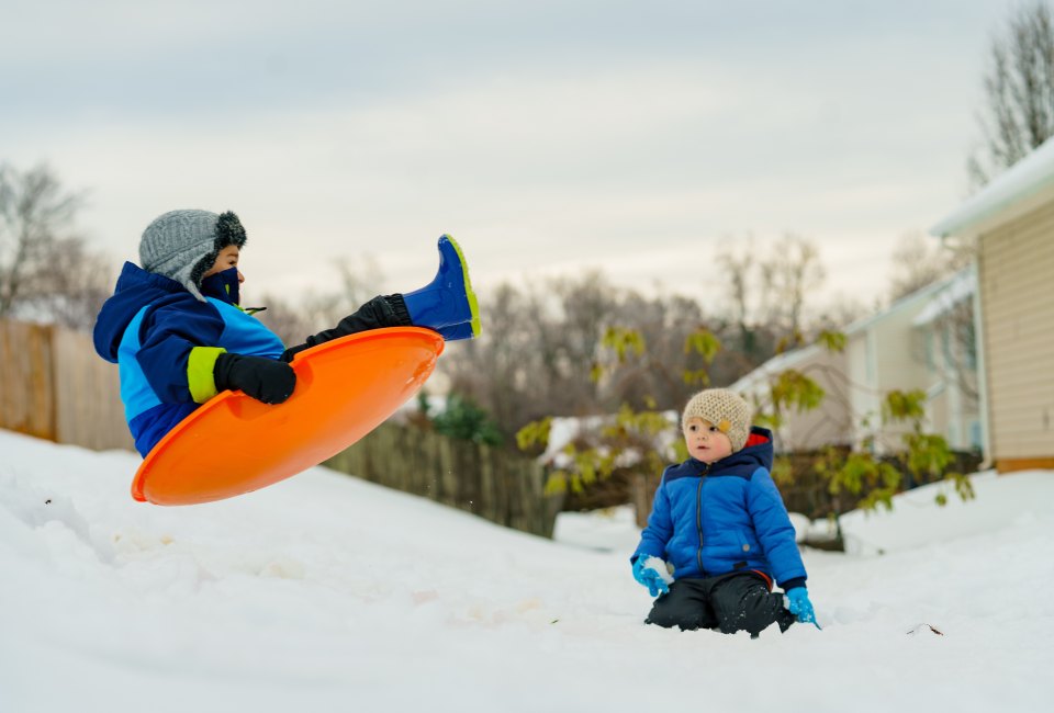 Catch some air on one of the many sledding hills in the Hudson Valley. Photo by Jeremy McKnight on Unsplash.