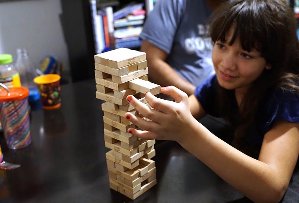 Pull out a block, place it on top but don't let the tower fall in the fun and challenging Jenga. 